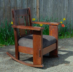 Original Vintage Charles Stickley rocker with cut outs in the crest rail and center slat and large through tenons. Excellent fine original finish, signed.